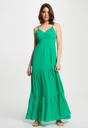 Groene maxi-jurk met spaghettibandjes, voorzien van geborduurd lijfje en gelaagde rok met oogjesdetails. Zacht, vloeiend stof.