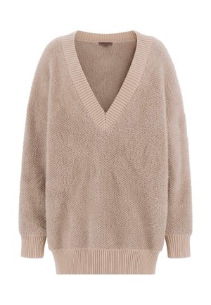 Jasnobeżowy, puszysty sweter z głębokim dekoltem w kształcie litery V oraz prążkowanymi wykończeniami na kołnierzu i mankietach. Luźny, oversized fason z fakturowanej tkaniny.