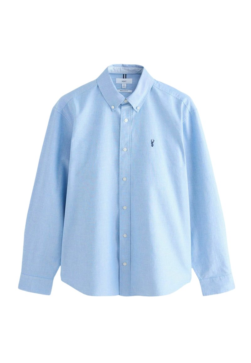 Chemise bleu clair à manches longues, col traditionnel, et petit logo brodé sur la poitrine. Fabriquée en tissu de coton.