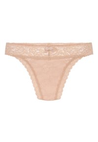 String en dentelle beige clair avec des bords festonnés et un petit nœud à l'avant. Motif floral sur l'ensemble du tissu.