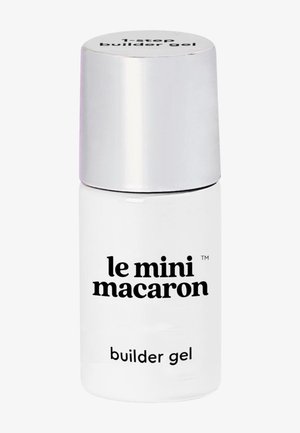 Kleine weiße Flasche mit silbernem Verschluss, beschriftet mit "le mini macaron builder gel" zur Nagelverstärkung.