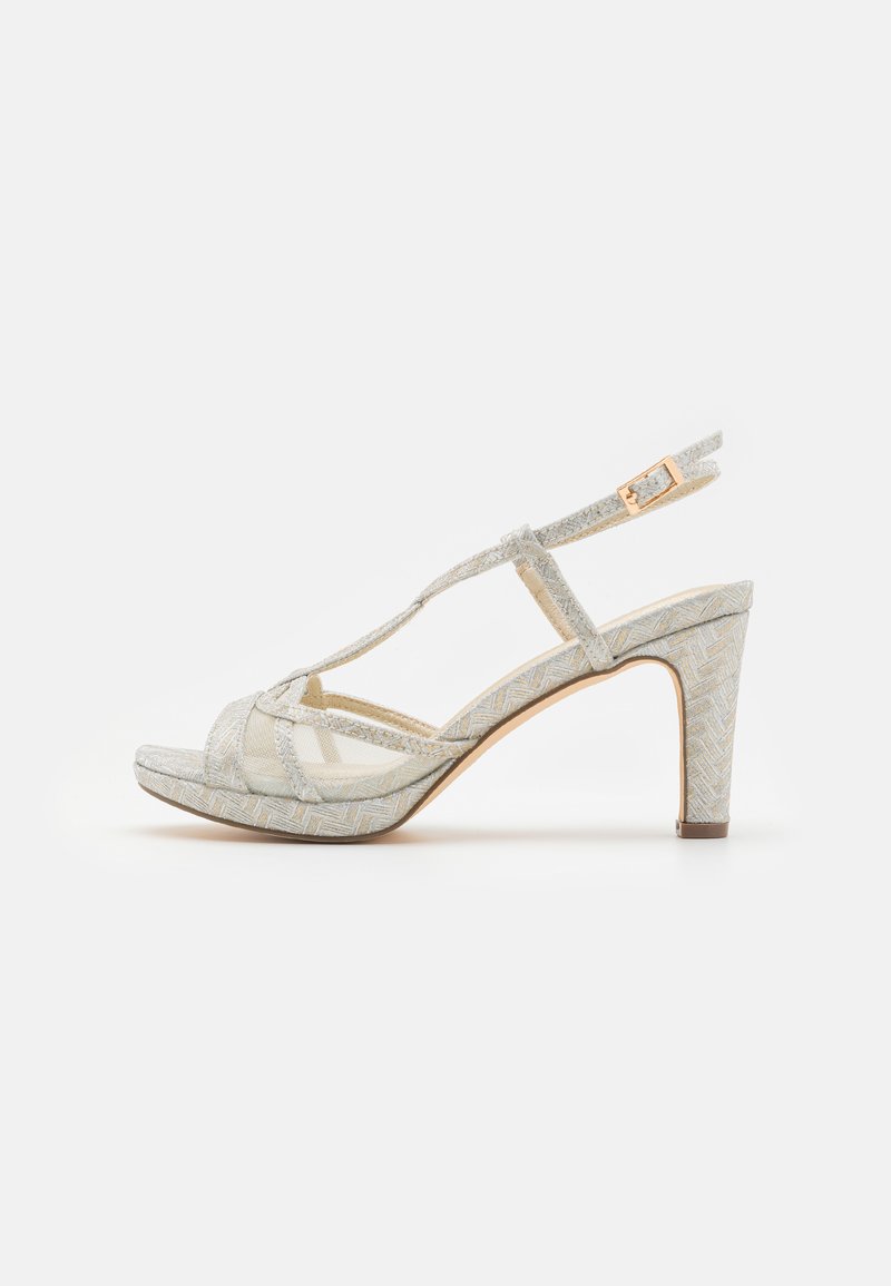 Beige and silver heeled sandal with a mesh and textured fabric upper, open toe design, T-strap detail, and a slender ankle strap.