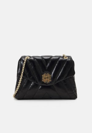 Black quilted leather handbag with gold-tone chain strap and ornate front clasp. Features chevron pattern and a soft, glossy texture.