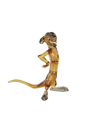 Amber-colored crystal figurine of a meerkat with a geometric design, standing with one hand on its hip and a curved tail.
