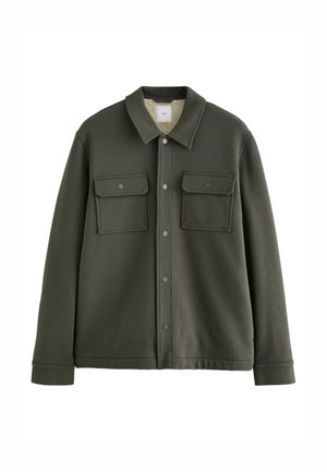 Olivgrüne Jacke aus strukturiertem Material, mit einem Kragen, zwei Brusttaschen und Druckknopfverschlüssen. Mit einem weichen Innenfutter gefüttert.