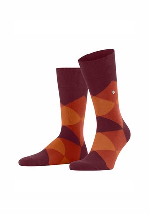 Colorful socks featuring a geometric pattern of maroon, orange, and peach, displayed upright against a white background.