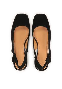 Black suede slingback shoes featuring a square toe, cut-out sides, and a knotted accent at the heel. Tan inner lining.