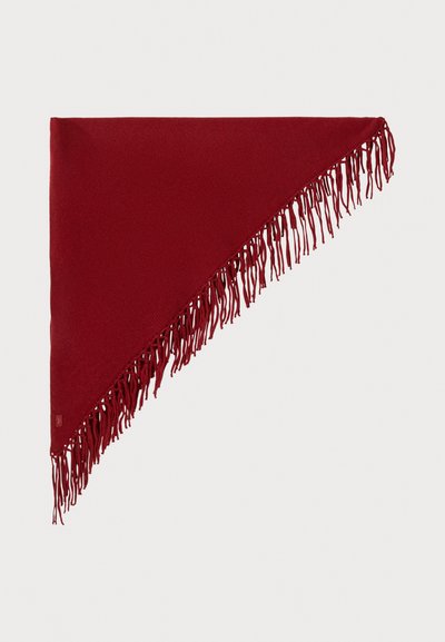 Red triangular shawl with textured fabric, featuring long fringes along one edge and a small tag on the bottom corner.