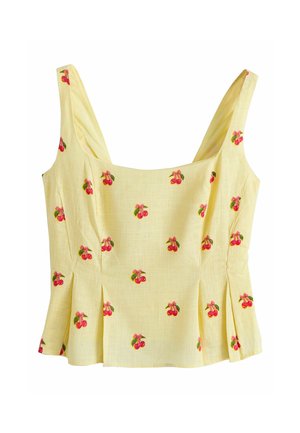 Gelbes ärmelloses kurzes Oberteil mit quadratischem Ausschnitt und roten Kirschenmustern, die über den Stoff verteilt sind.