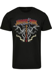 Sort bomulds t-shirt med grafisk tryk af dinosaur skeletter og "Jurassic Park" tekst i fede farver og lynmønstre.