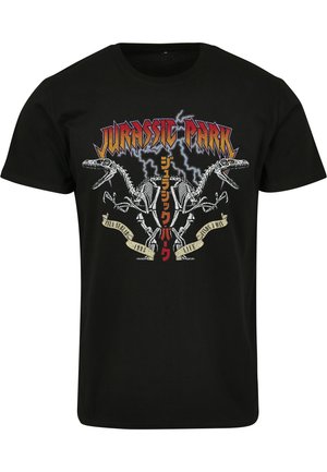 Sort bomulds t-shirt med grafisk tryk af dinosaur skeletter og "Jurassic Park" tekst i fede farver og lynmønstre.