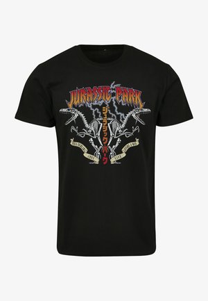 Sort bomulds t-shirt med grafisk tryk af dinosaur skeletter og "Jurassic Park" tekst i fede farver og lynmønstre.