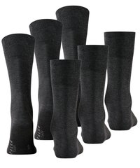 Calcetines negros hechos de una tela suave, con una textura acanalada en la parte superior. Seis pares exhibidos con el logo cerca de la parte inferior.