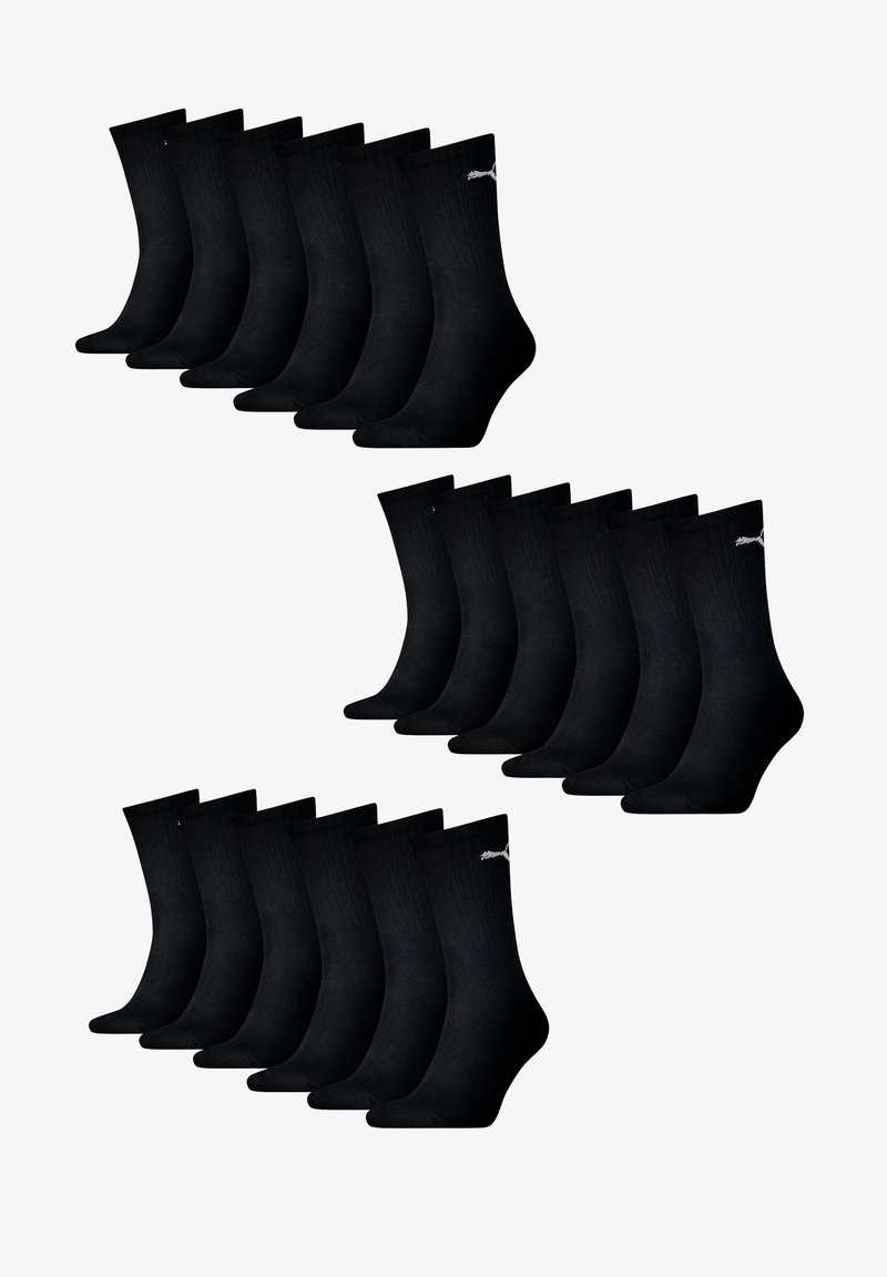 Schwarze Baumwollsocken, mit gerippter Textur, knöchellang, mit einem kleinen weißen Logo am Bund. Zwei Stapel mit acht Paaren enthalten.