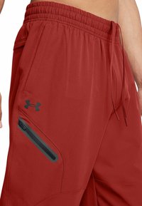 Under Armour Tygbyxor - orange