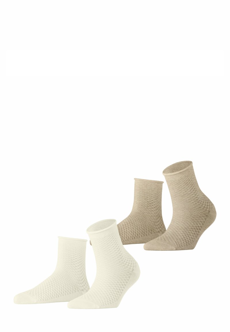 Set van vier enkelsokken in wit en beige. Geweven patroon over de hele sok, met een geribbelde rand. Gemaakt van een zachte, rekbare stof.