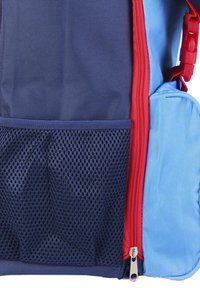 Navy backpack with red zipper and blue accents; features a mesh pocket on one side, smooth fabric, and a sturdy zipper closure.