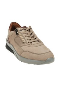 Beige suede sneaker with brown leather accents, lace-up front, and side zipper. Features a gray rubber outsole and textured detailing.