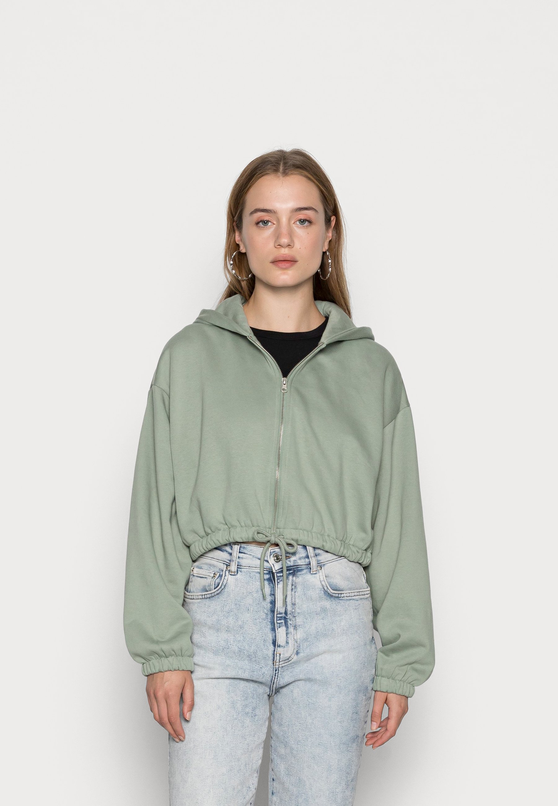 green zip up