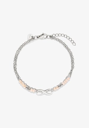 Silver double chain bracelet with an infinity symbol center and small peach-colored faceted beads along the sides, with lobster clasp.