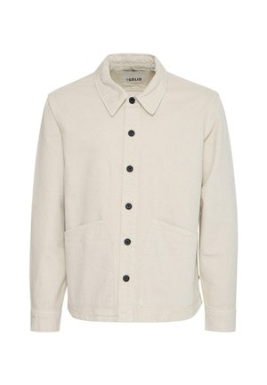Beige cotton jacket featuring a structured collar, front button closure, two large pockets, and black buttons for contrast.