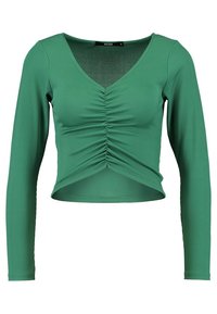 Green ribbed long-sleeve crop top with a V-neck, ruched front detail, and fitted silhouette. Soft texture and stretchy fabric.