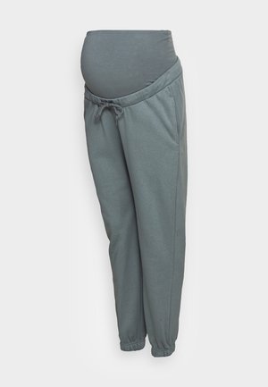 Pantalon de grossesse gris en molleton avec taille élastique couvrant le ventre, cordon de serrage à l'avant, poches latérales et chevilles élastiquées.