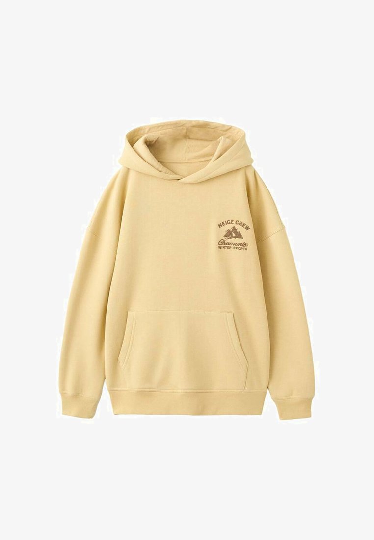 Žltá mikina s kapucňou z mäkkej tkaniny, s klokankou, šnúrkou na kapucni a potlačou s nápisom "Neige Crew" a horskými motívmi.