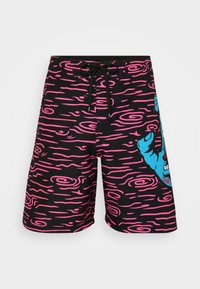 Calções de banho pretos com padrões ondulados em rosa, apresentando uma gráfica azul da cara de um urso. Inclui um cós ajustável com cordão.