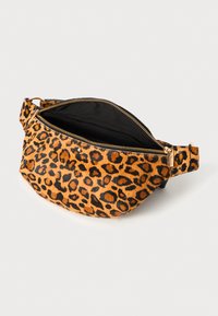 Leopard print waist bag in textured orange and black faux fur, featuring a zipper closure and a single adjustable strap.