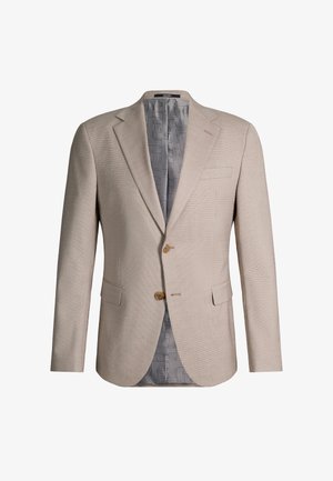 Beżowa marynarka męska z dwoma brązowymi guzikami, klapą z wycięciem, przednimi kieszeniami z patkami i wzorzystą szarą podszewką.