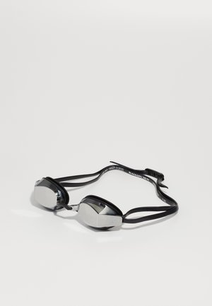Lunettes de course noires avec verres miroités, joints en matériau similaire au caoutchouc et sangle noire ajustable. Design géométrique unique autour des verres.