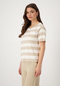 Beige and white striped short-sleeve top with a round neckline and a chest pocket. Smooth fabric with a relaxed fit.