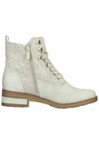 Bottine ivoire à lacets à l’avant, zip latéral, tissu supérieur à motifs, et semelle en caoutchouc beige clair avec petit talon.