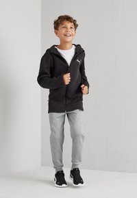 Puma EVOSTRIPE HOODIE - Sudadera con cremallera - black