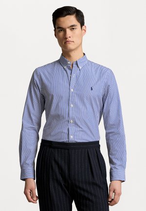 Blue and white striped button-up shirt with a classic collar and long sleeves, made of cotton fabric, featuring a small logo on the chest.