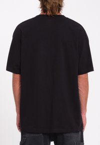 Black short-sleeve t-shirt with a relaxed fit, cotton material, crew neck design, and plain texture, featuring no visible logos or accents.