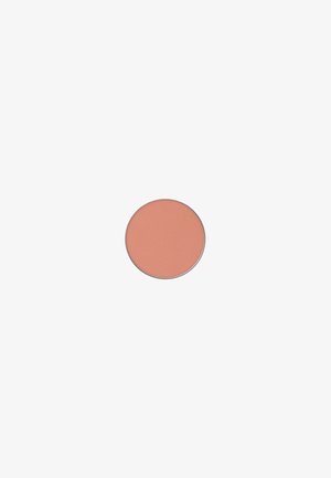Round blush pan with a textured surface. Features a soft peach color in a metal casing, without additional decoration or accents.