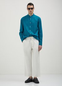 Calliope CORTI WIDE  - Jogginghose - bianco