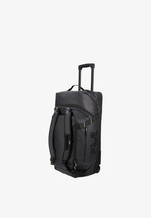 Bolsa de viaje negra con ruedas, asa extensible, correas para el hombro, bolsillo lateral con cremallera y logotipo de Jack Wolfskin en el lateral.