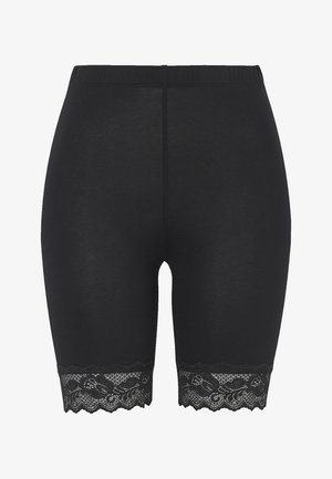 Svarta shorts i mjukt material med en bred midja och dekorativ spetskant längs nederdelen, med ett vågigt kantmönster.