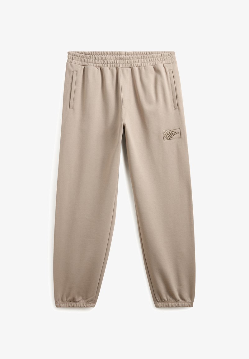 Beige Sweatpants mit elastischem Bund, seitlichen Taschen, schmal zulaufenden Beinen und gesticktem Logo auf dem linken Oberschenkel. Glatte Stofftextur.