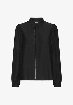 Blouse noire avec un col, des manches bouffantes longues et une patte de boutonnage centrale ornée d'une rangée décorative de petites perles blanches.