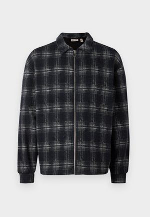 Black and grey plaid jacket with a zip front, collar, and elastic cuffs. Made from a soft, textured fabric. Casual design.