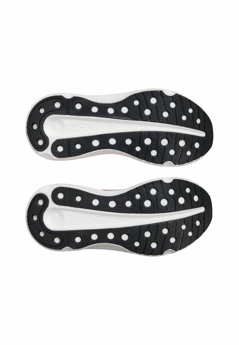 Suela de caucho negra con patrón de tracción circular, entresuela blanca, soporte arco pronunciado y superficie texturizada para mayor agarre.