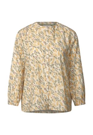 Blumenbluse mit langen Ärmeln, die ein Muster in Gelb, Pink und Grün auf einem hellcremefarbenen Hintergrund zeigt. Knopfleiste vorne.