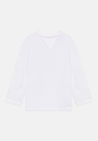 Fehér hosszú ujjú ing, V-nyakkivágással és letisztult, egyszerű dizájnnal. Puha pamutból készült, sima textúrával és látható minták nélkül.