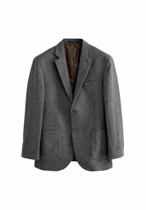 Blazer en laine gris à chevrons avec revers crantés, deux poches plaquées à l'avant, deux boutons et doublure intérieure marron foncé visible.