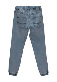 Light blue denim jogger pants with an elastic waistband and cuffed ankles. Features two back pockets with contrasting stitching detail.