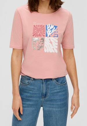 Light pink short-sleeve t-shirt with a graphic design featuring abstract coral shapes in blue, pink, and metallic silver accents.